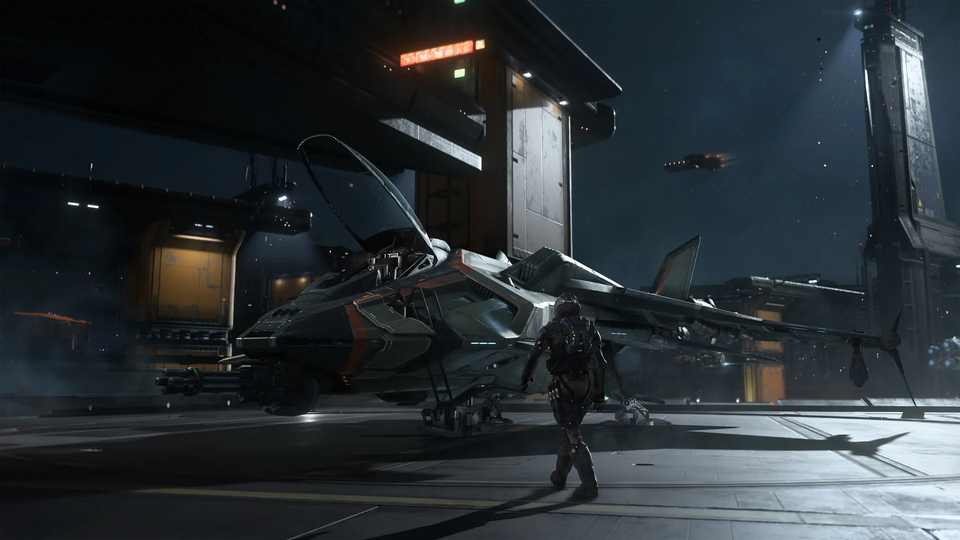 Official Steam screenshot of a fighter parked on a night hangar deck